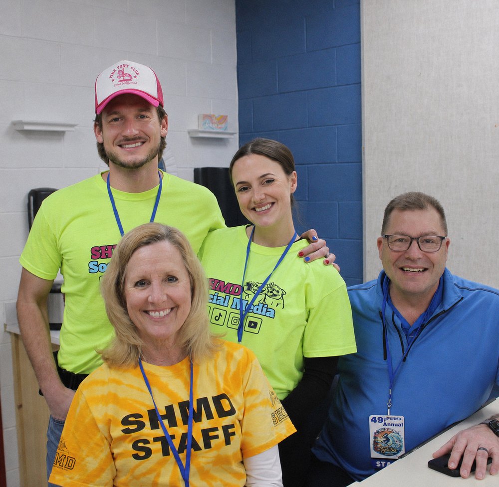 Pat Fish with his wife, mother, and father at the 49th Annual South High Marathon Dance, all wearing event shirts and lanyards.